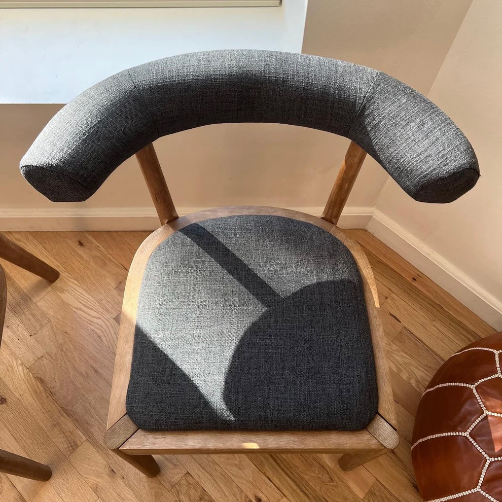 overview of ergonomic backrest on solid wood and navy upholstery dining chairs for mid century modern dining room