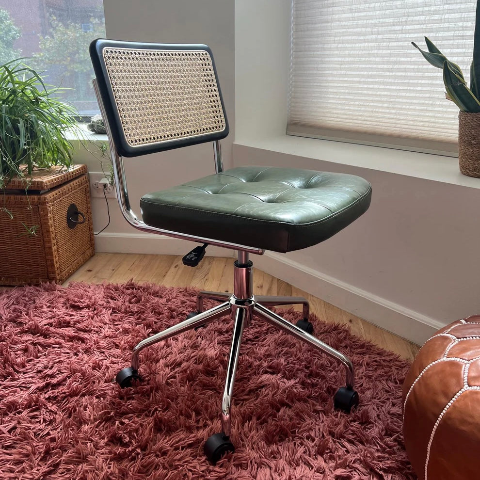 green vegan leather seat on a mcm office chair with rattan back rest