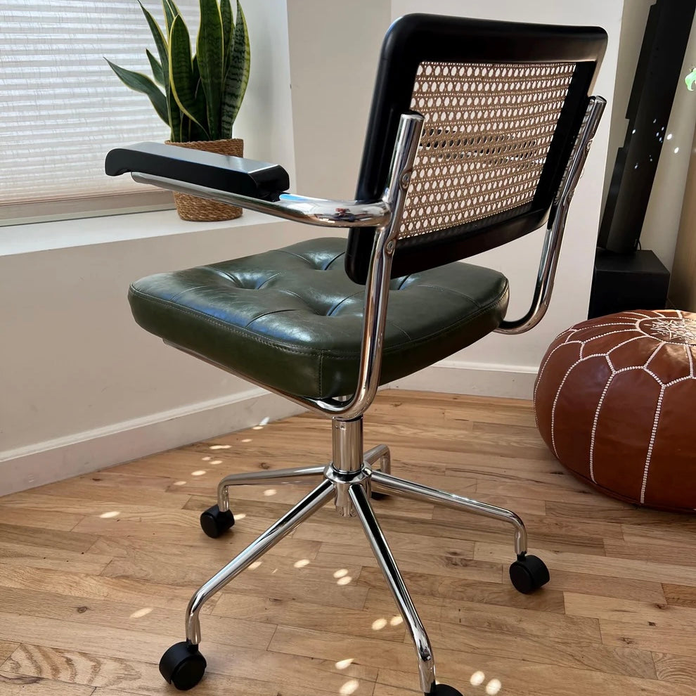 rear view of mid century modern office chair black wood stain green vegan leather seat and stainless steel frame
