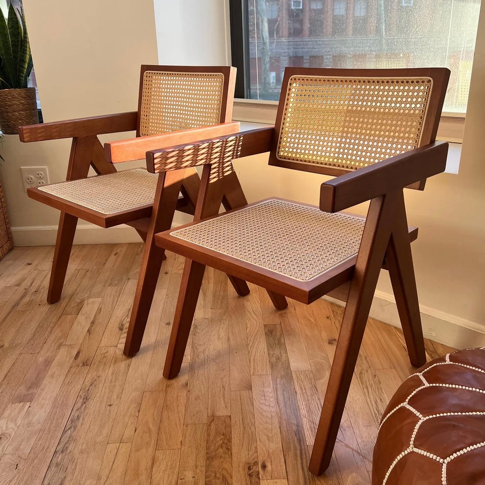 Walnut stain solid wood dining chairs with natural rattan seats and seatbacks in mid century modern style
