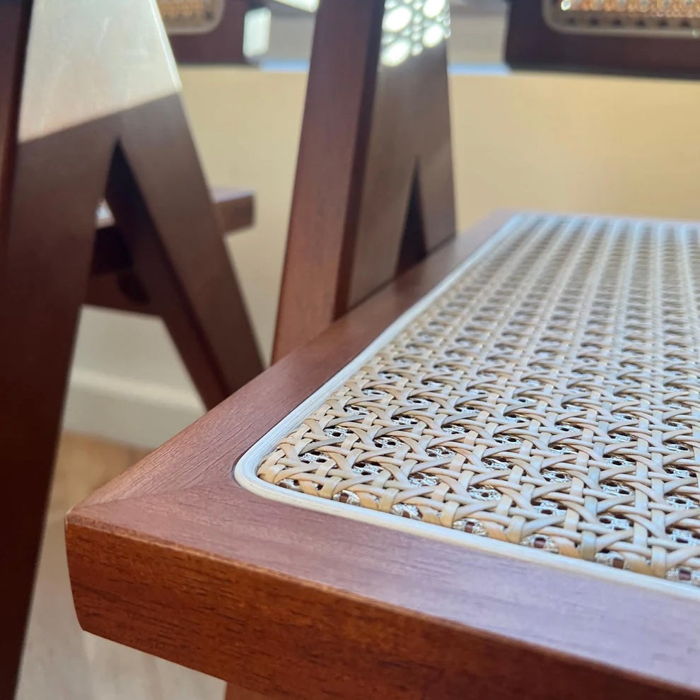 Side closeup of woodgrain pattern and walnut stain on mcm solid wood dining chair