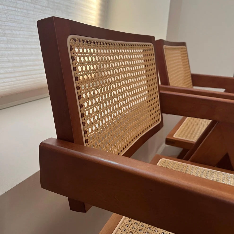 side profile of rattan seatback on walnut stain mid century modern dining chair