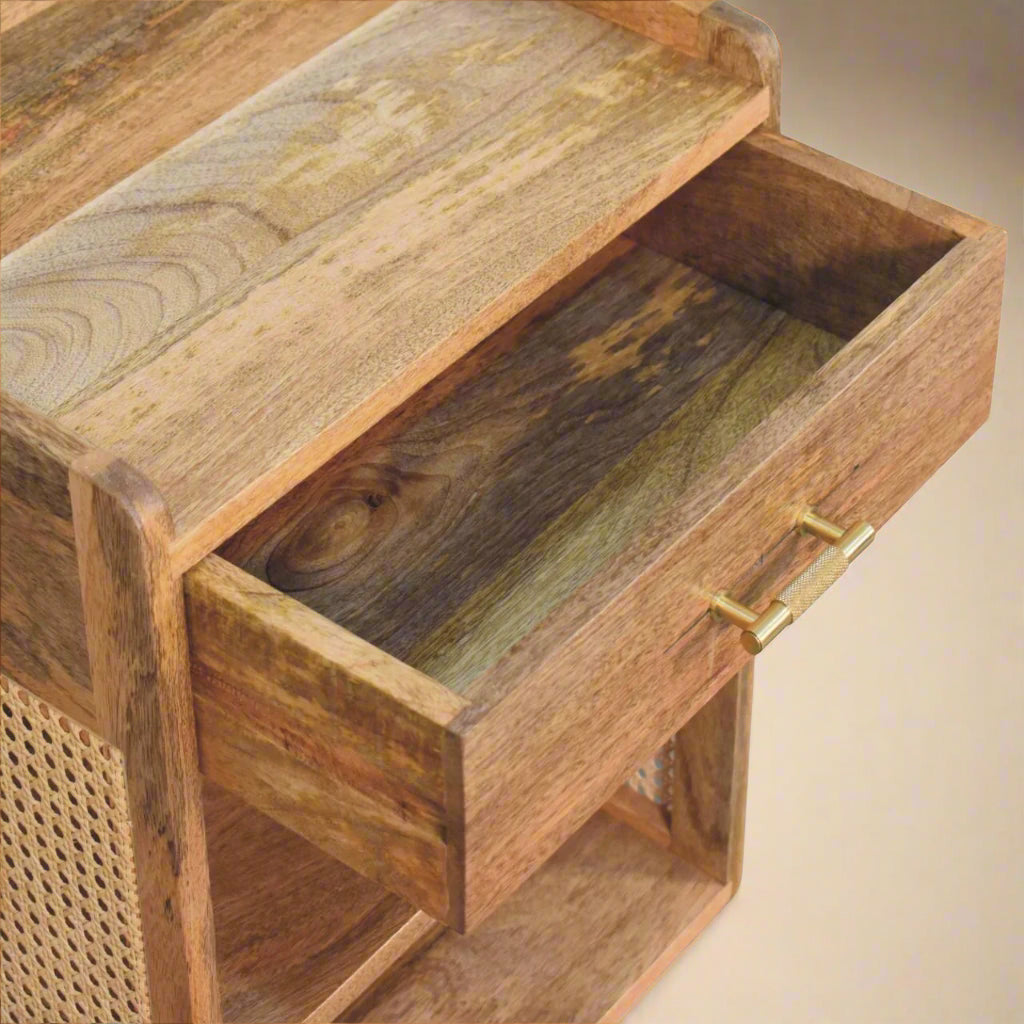 overview with open drawer showing solid mango nightstand drawer open wood is showing the coloration of natural mango and the rattan side is visible