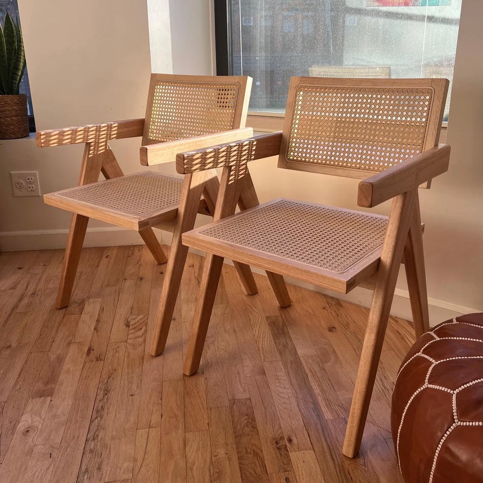 Front view of solid wood and rattan dining chairs in mid century modern style
