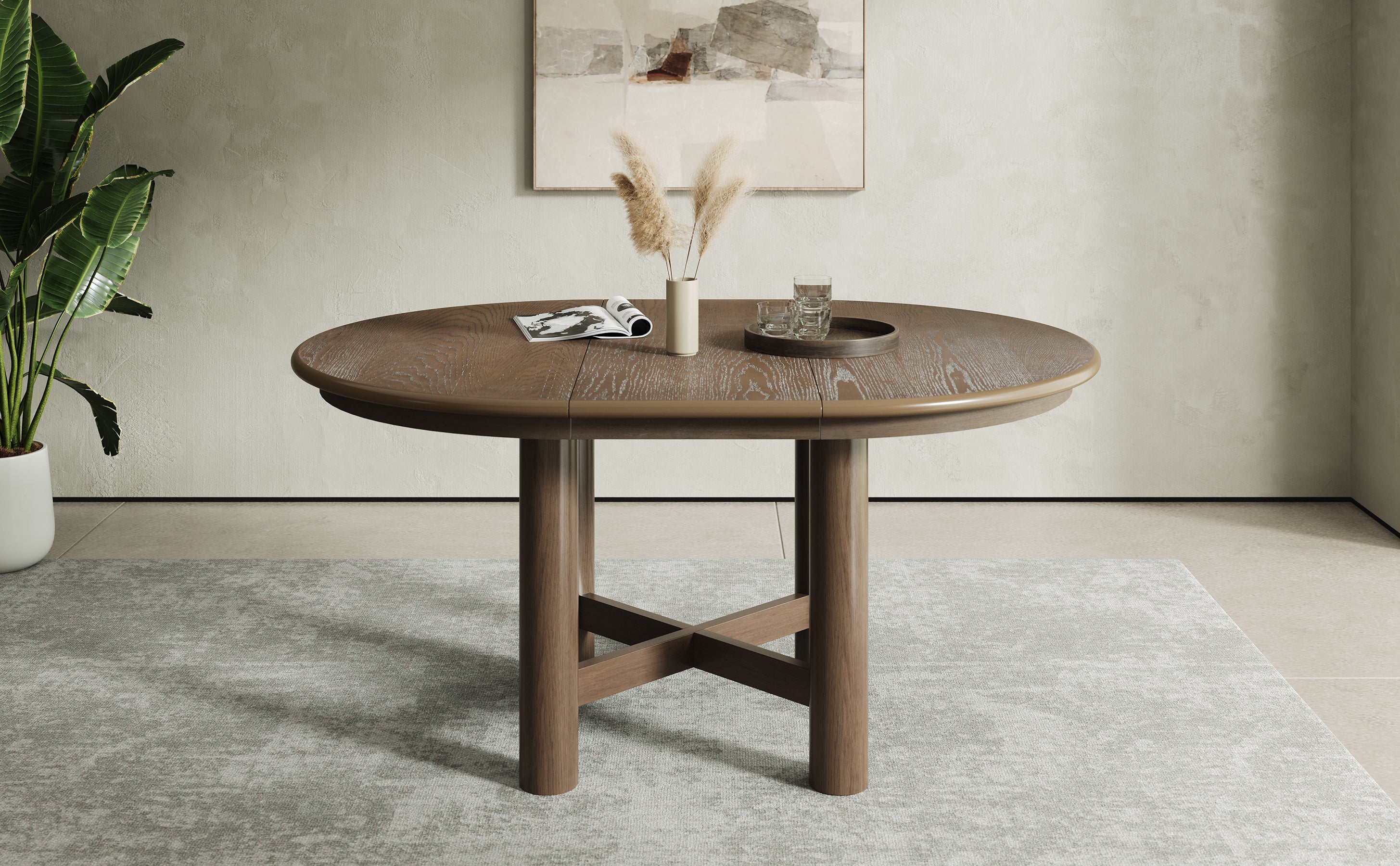 Angled studio view of the closed round oak-veneer table
