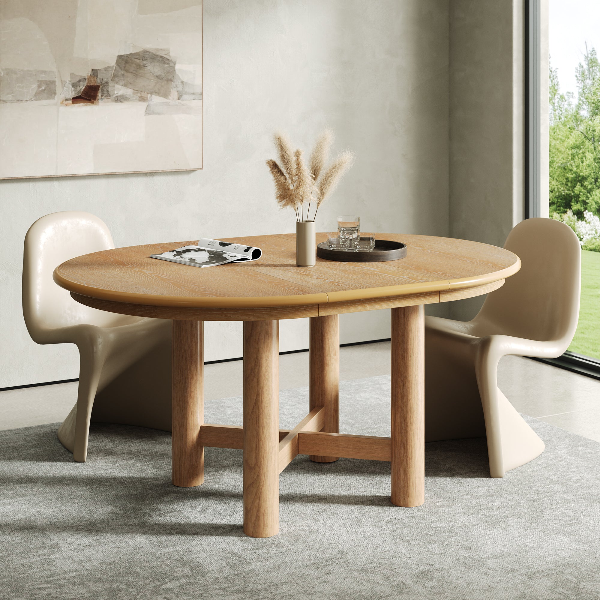 Round closed oak-veneer table with two glossy cream chairs by a window