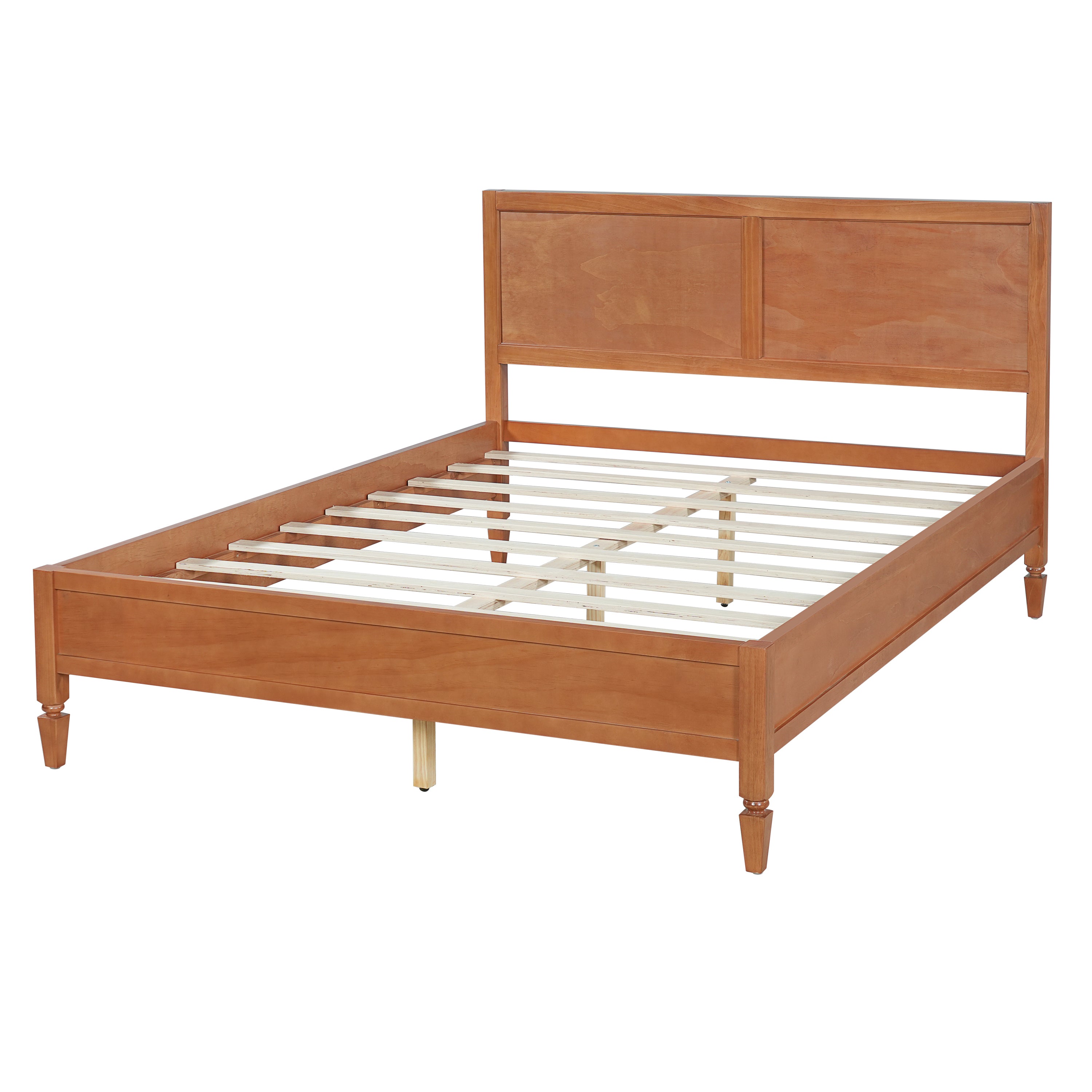 Studio angled full view of the brown wood platform bed frame with panel headboard and turned legs