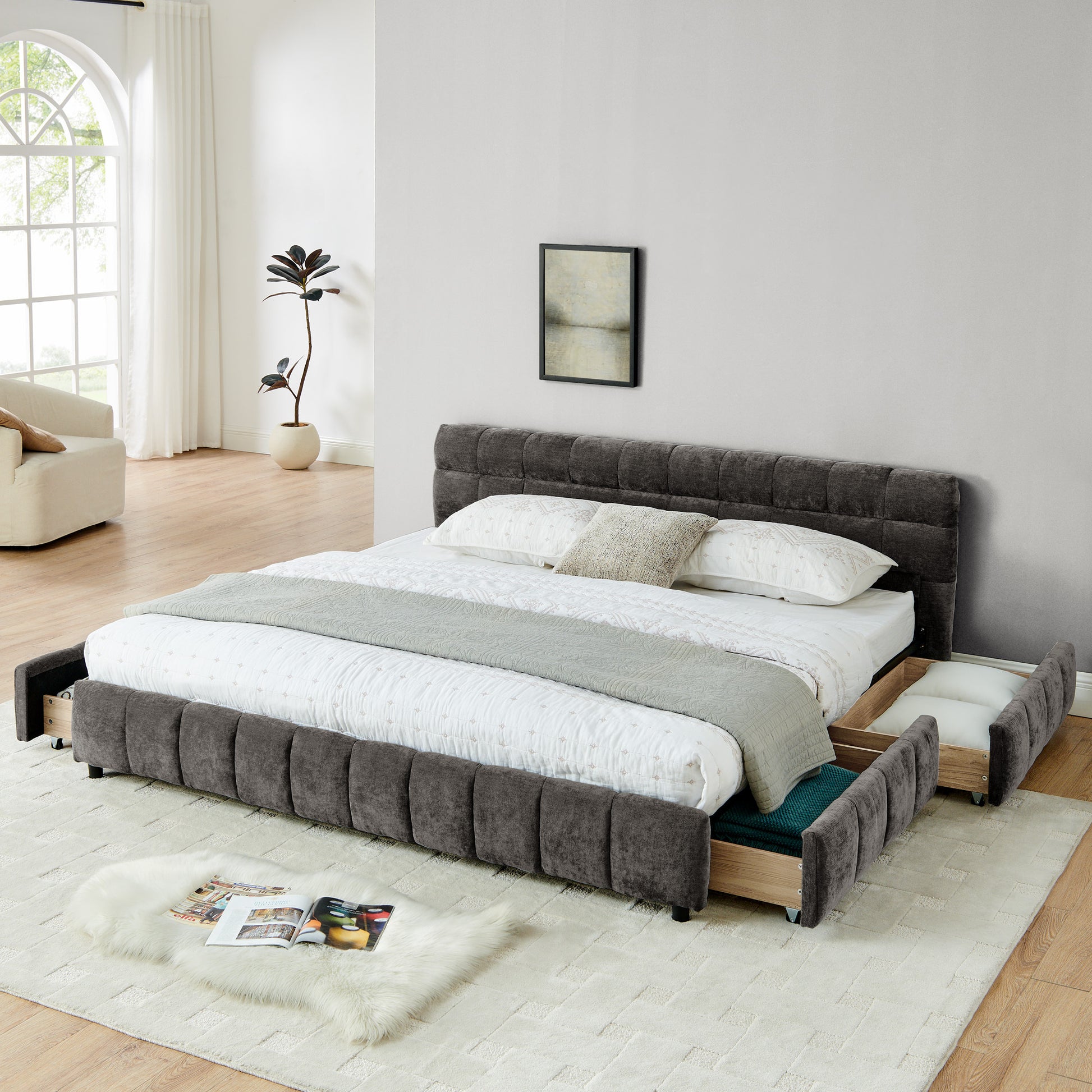 Dark gray chenille king bed frame in bright bedroom with sofa