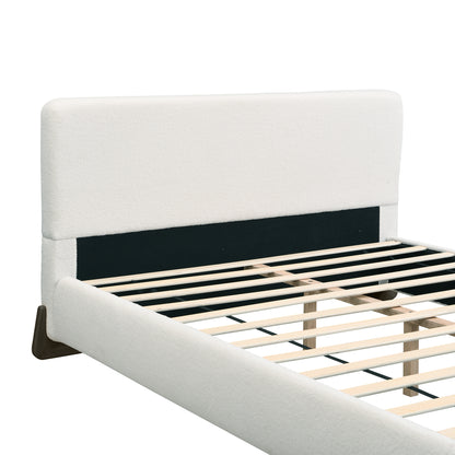 Close-up of white bouclé headboard corner with black interior support panel