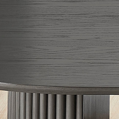 Close-up of the gray oak wood grain on the oval tabletop surface