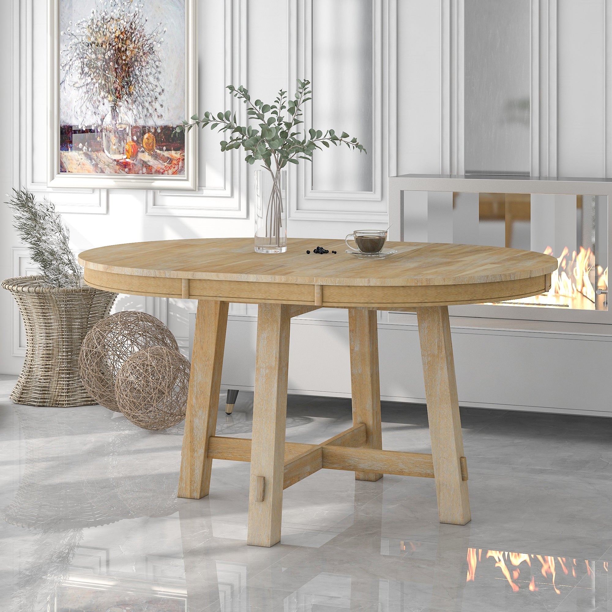 Styled room with oak round dining table, eucalyptus stems and coffee near a fireplace