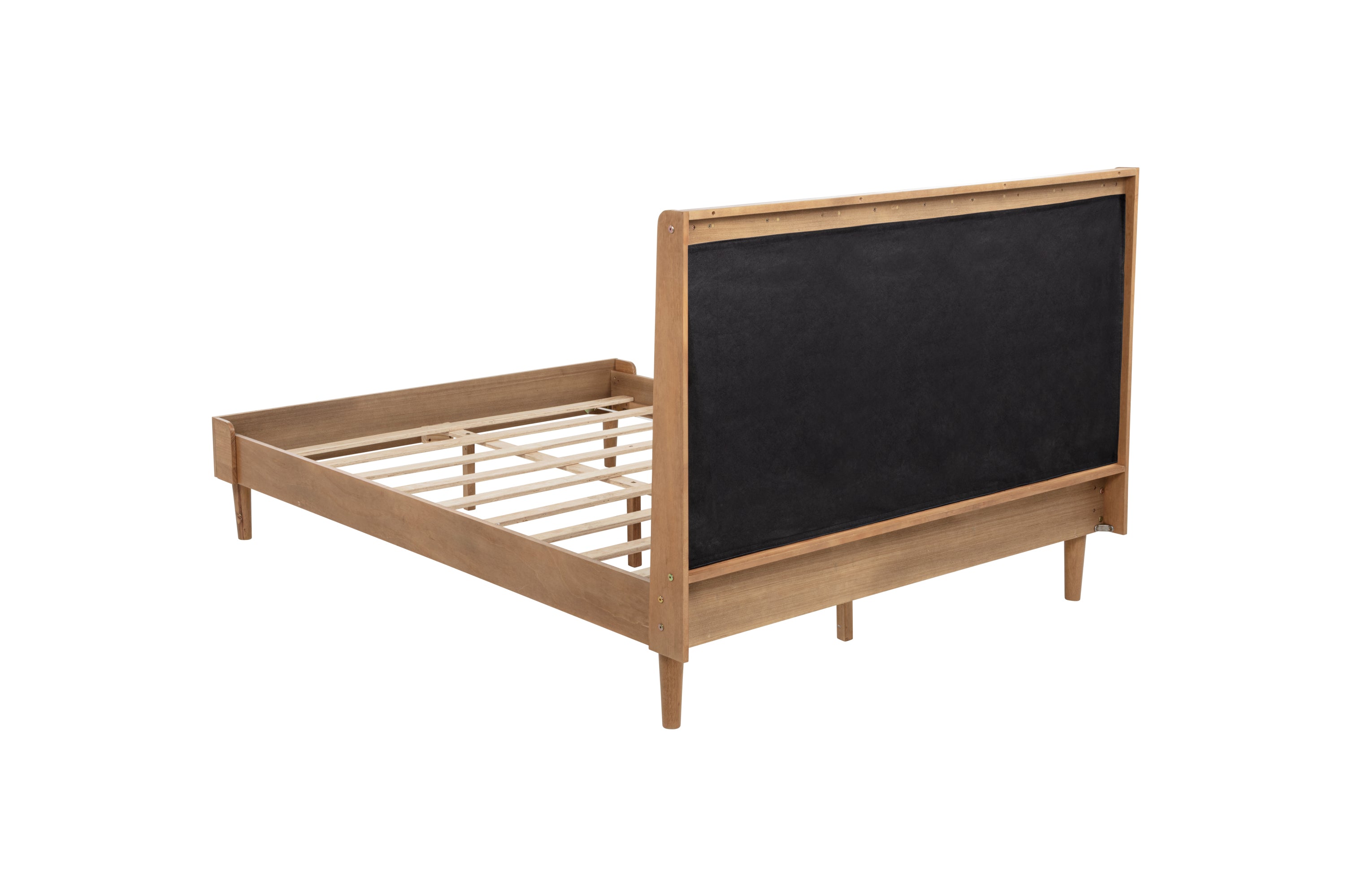 Rear side view of the headboard's black cloth backing on the wheat upholstered queen bed
