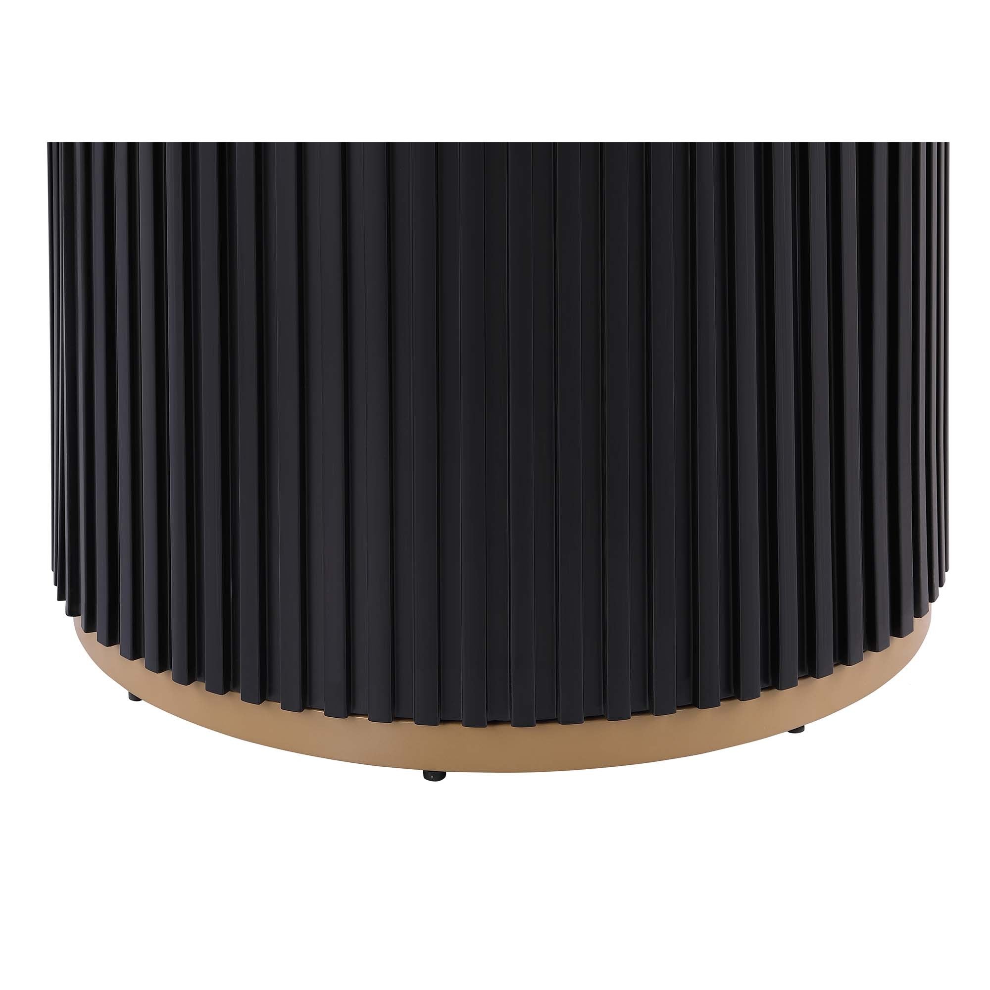 Close-up of the black fluted cylinder base and gold ring at the bottom