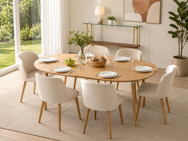 Oval oak-look extendable table with six beige chairs in a bright styled dining room