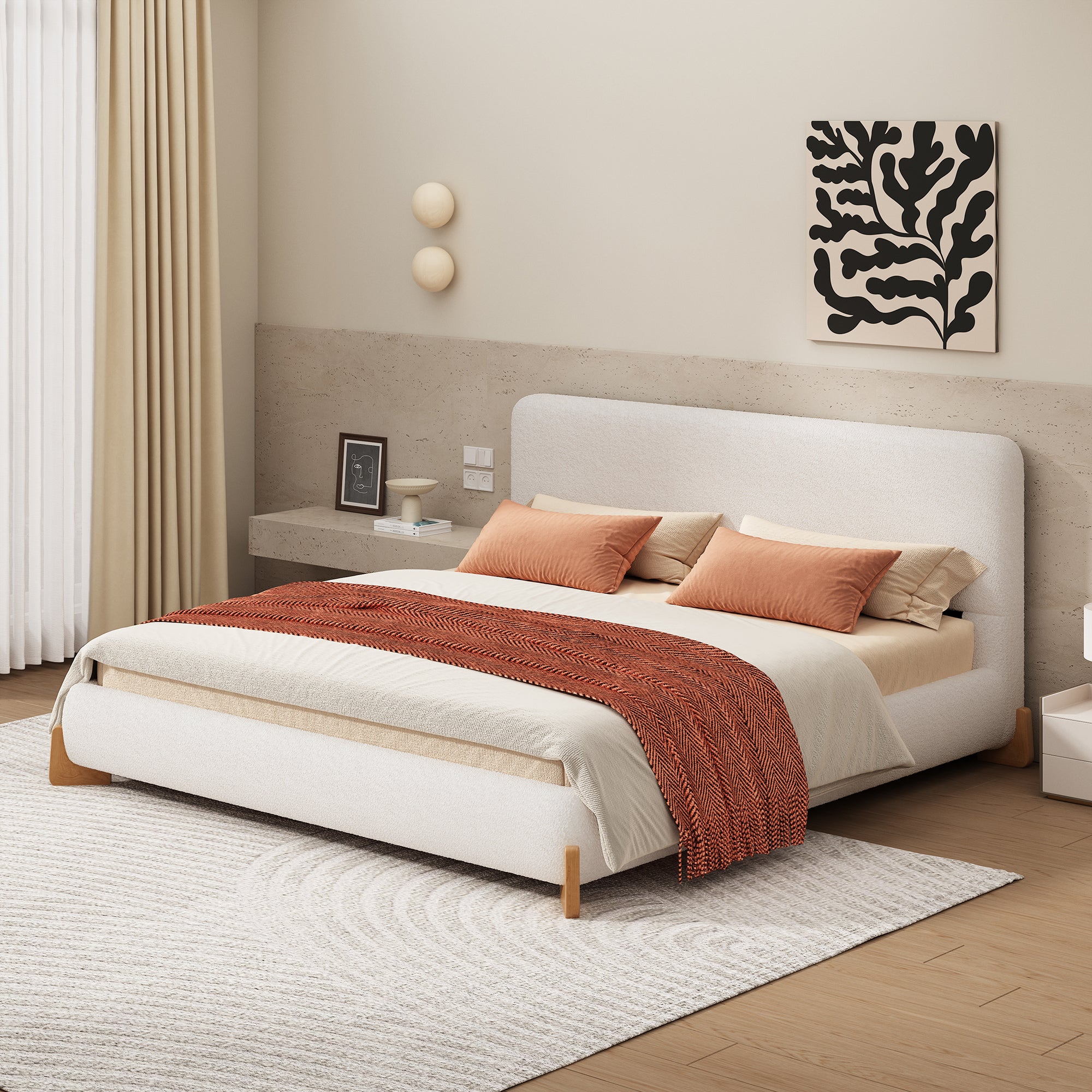 White boucle king bed in a bright bedroom with orange and cream bedding