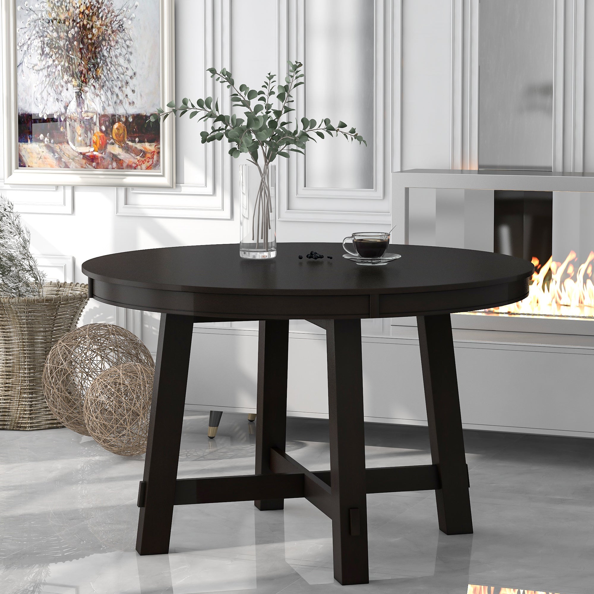 Espresso round dining table unextended, styled in a bright paneled dining room