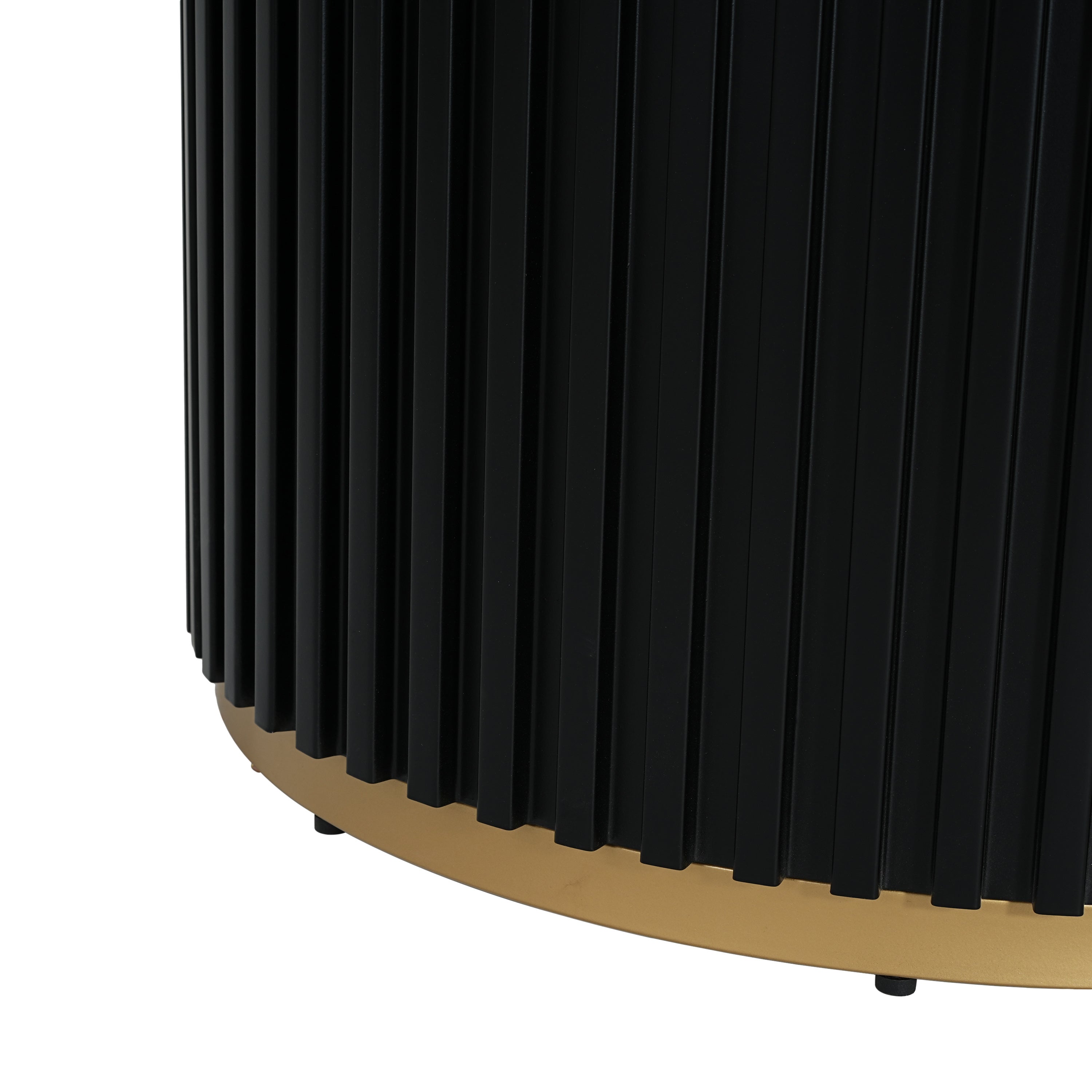 Close-up of the fluted black pedestal base and gold base ring