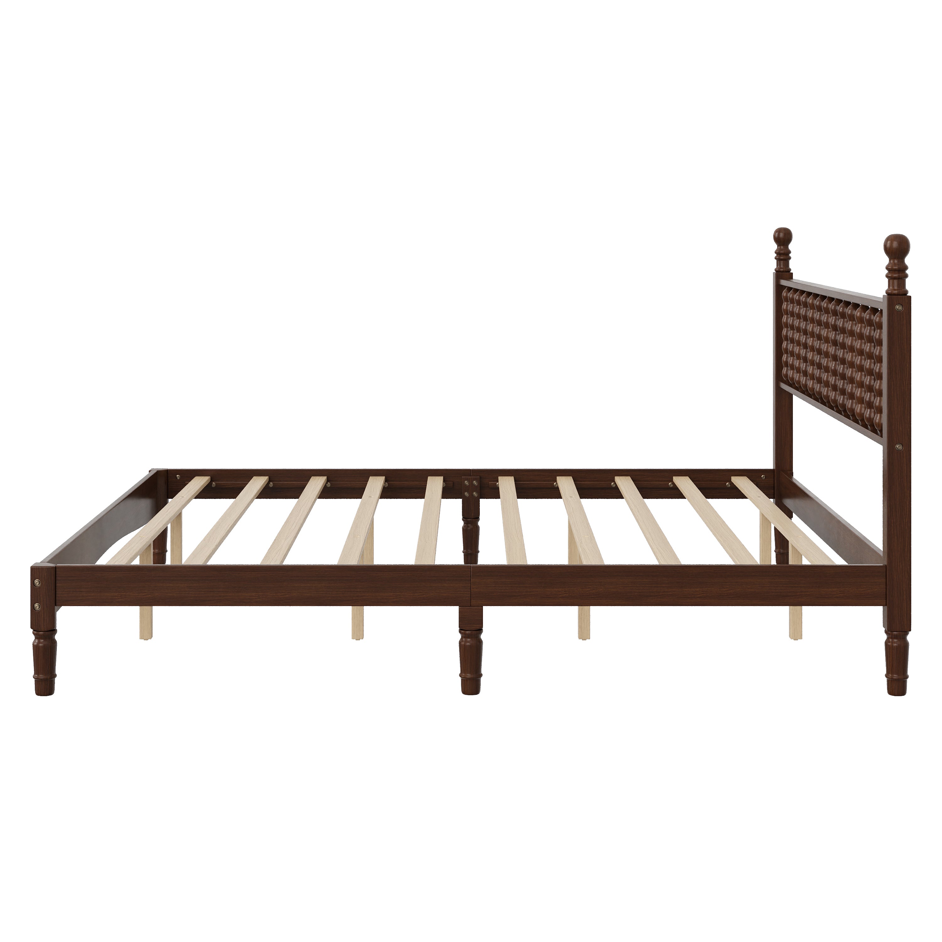 Close-up of turned spindle headboard on walnut king bed frame