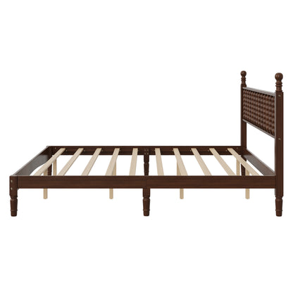 Close-up of turned spindle headboard on walnut king bed frame