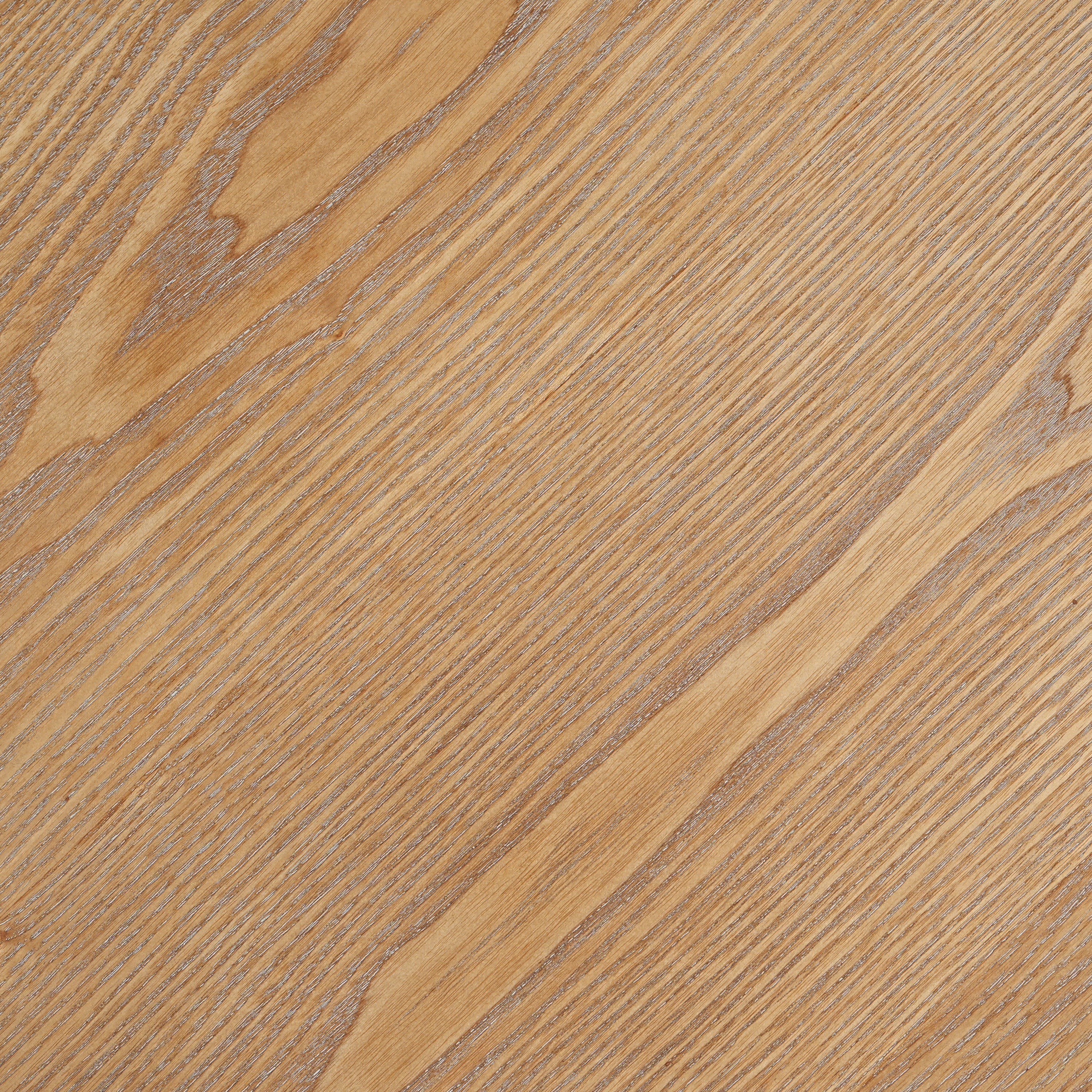 Close-up of the natural oak wood grain on the round tabletop