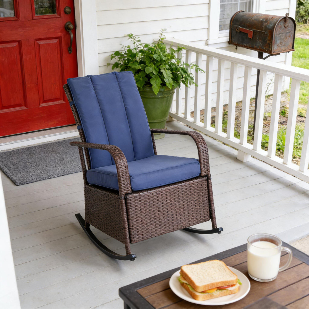 Brown Wicker Outdoor Rocking Chair with Blue Cushions