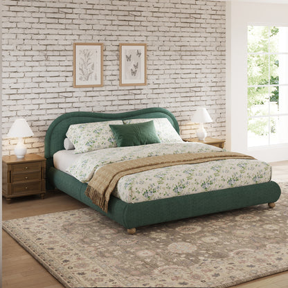 Olive green king bed frame in bedroom with brick accent wall