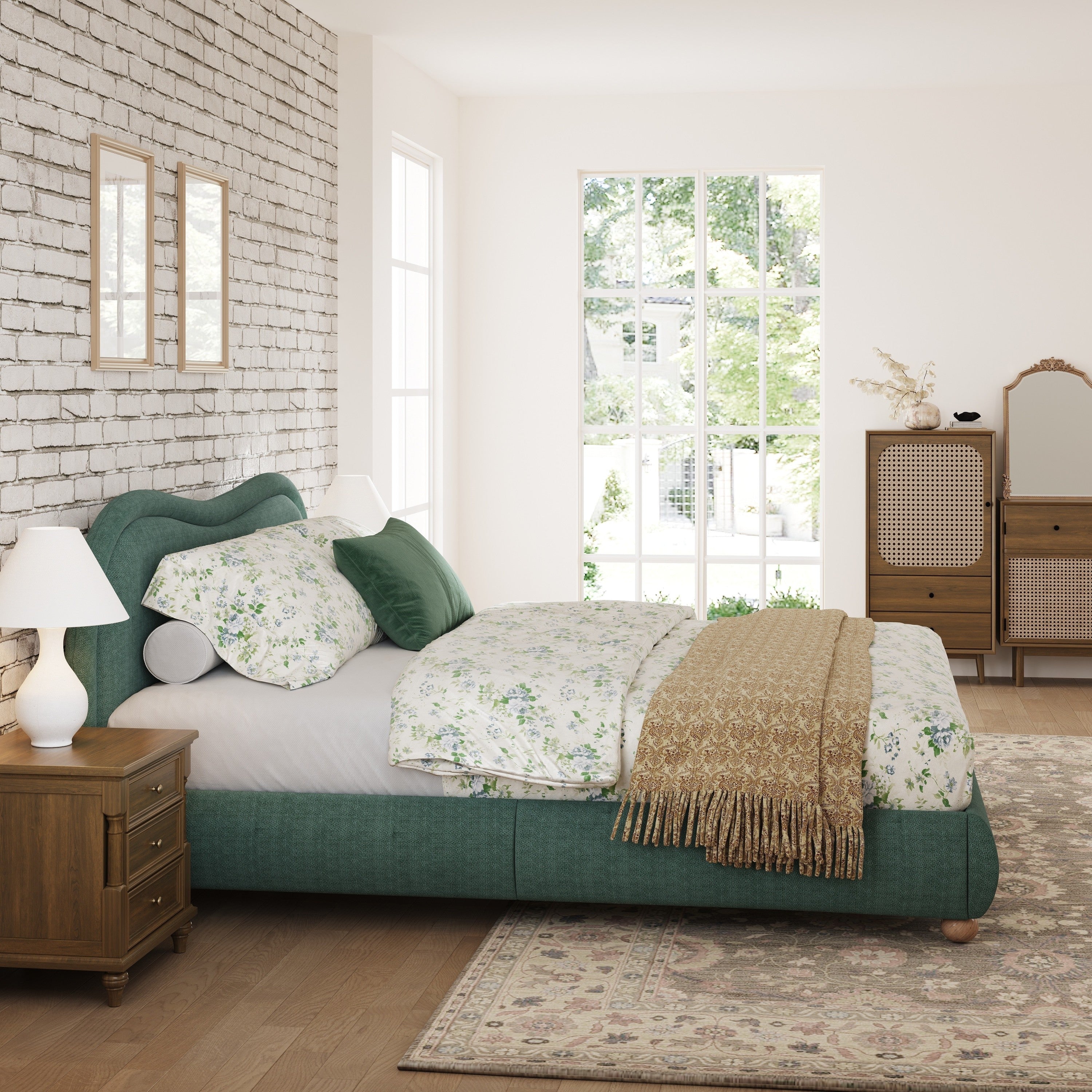 Olive green king bed in bright bedroom with garden-view door