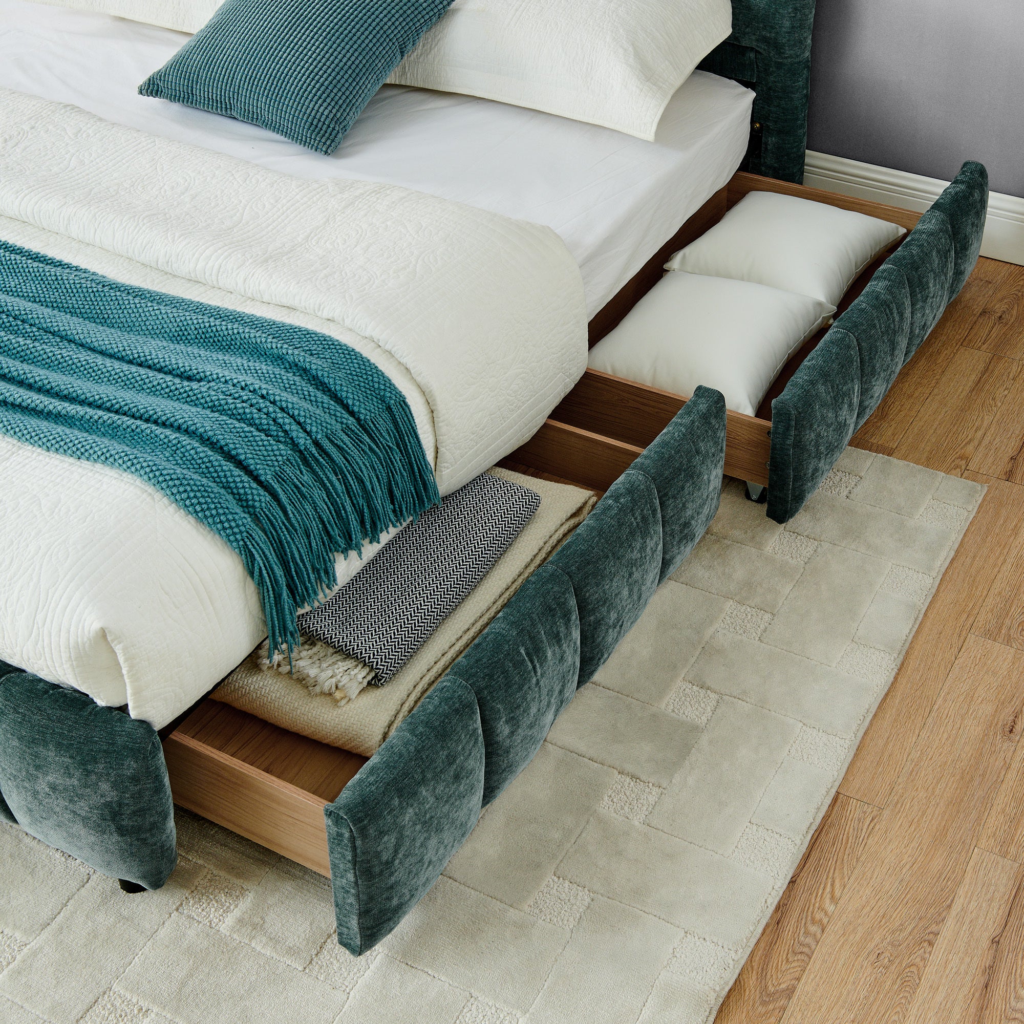 Angled view of open wood drawer with wood slat mattress support