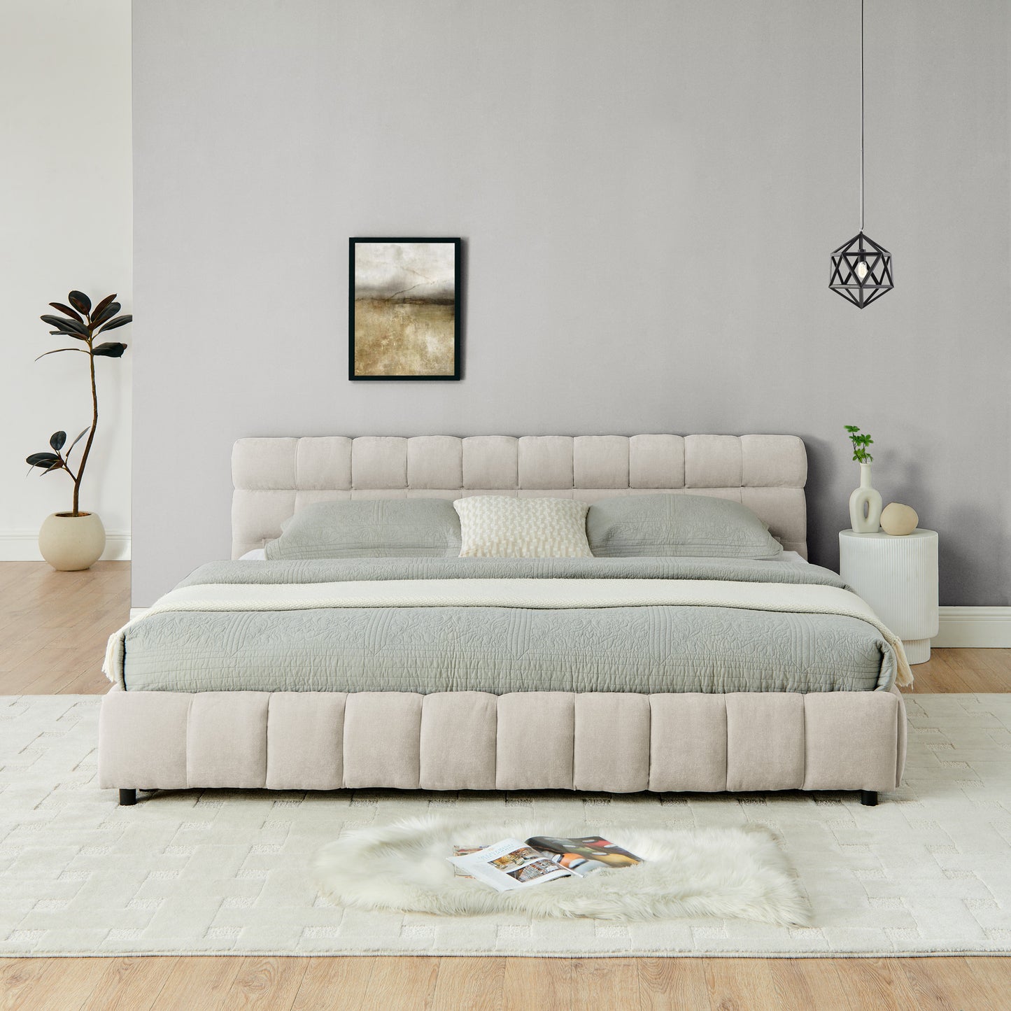 Angled bedroom view of beige chenille king bed with pendant light