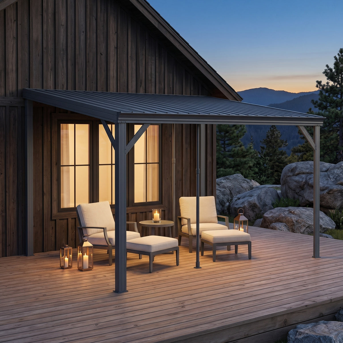 Gray metal 10x12 lean-to hardtop gazebo against a wood cabin over two lounge chairs on a deck at dusk