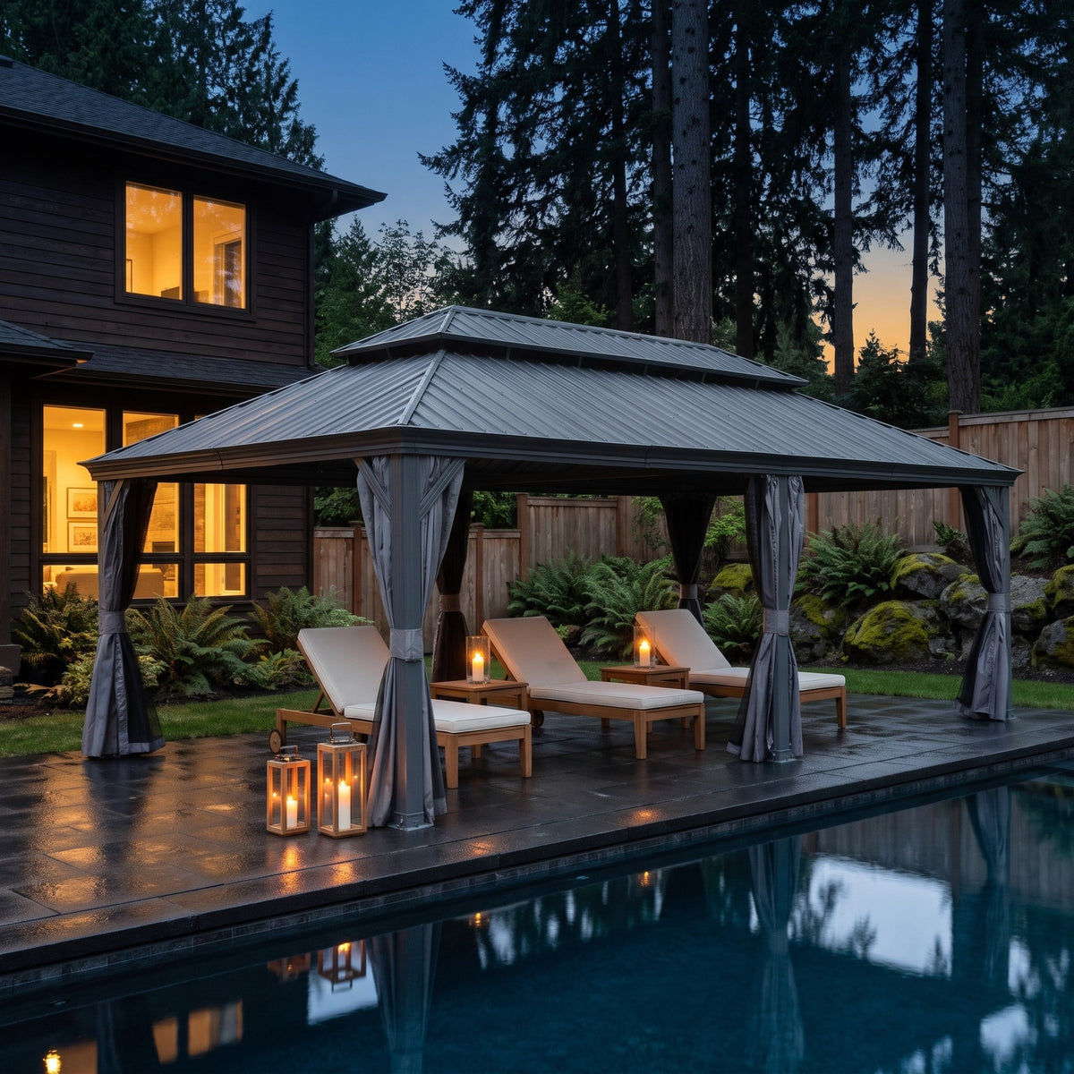Gray aluminum 14x22 double roof hardtop gazebo with tied back curtains over teak loungers beside a pool at dusk
