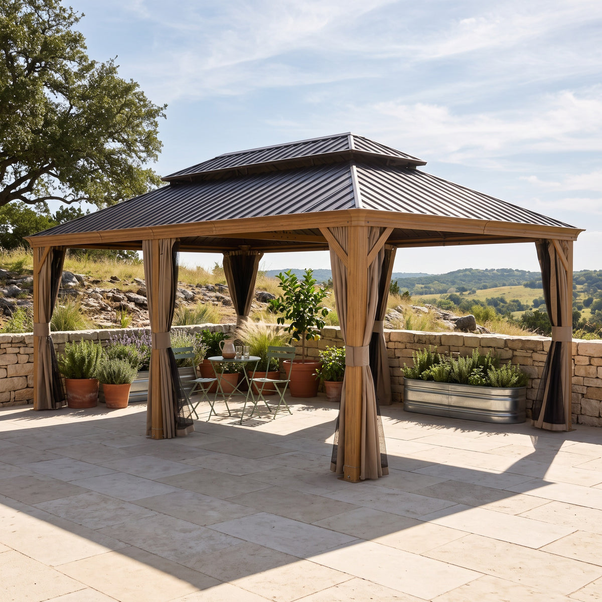 Wood-look aluminum 14x24 double roof hardtop gazebo with tied back curtains over a bistro set on a stone patio