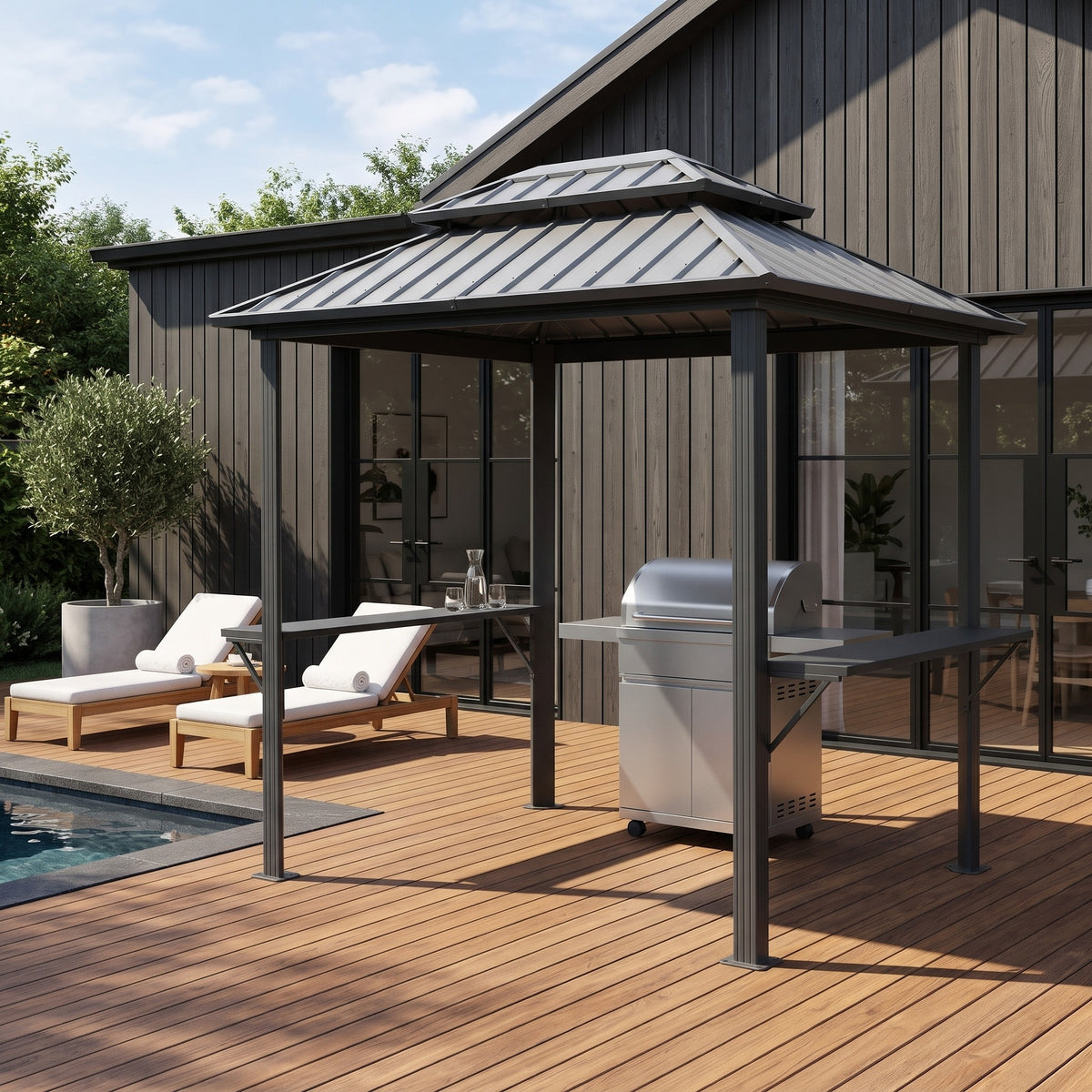 Gray 6x8 hardtop gazebo with two side shelves over a grill on a wood pool deck in afternoon sun