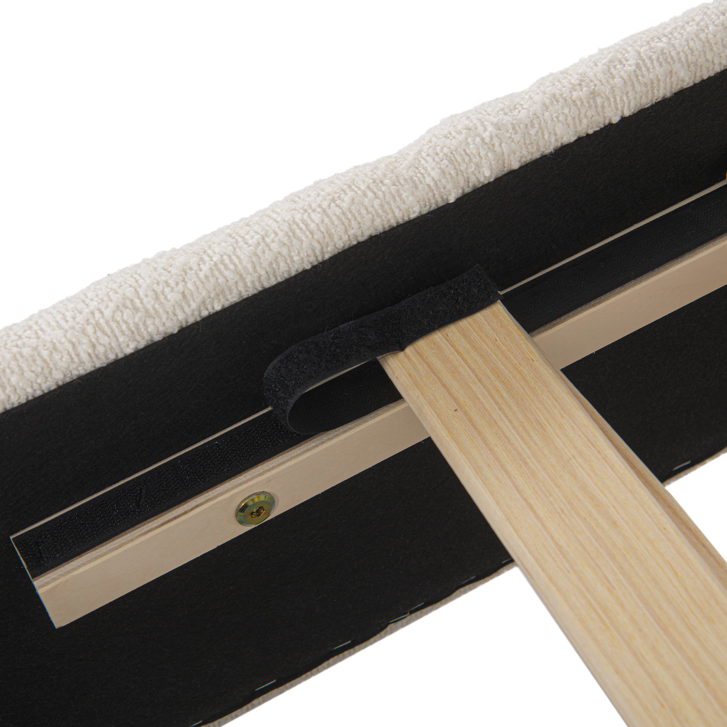 Close-up of metal corner bracket securing headboard to frame