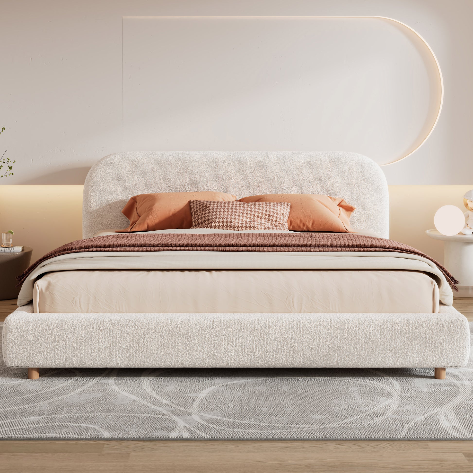 White boucle king bed, front view with orange and taupe bedding