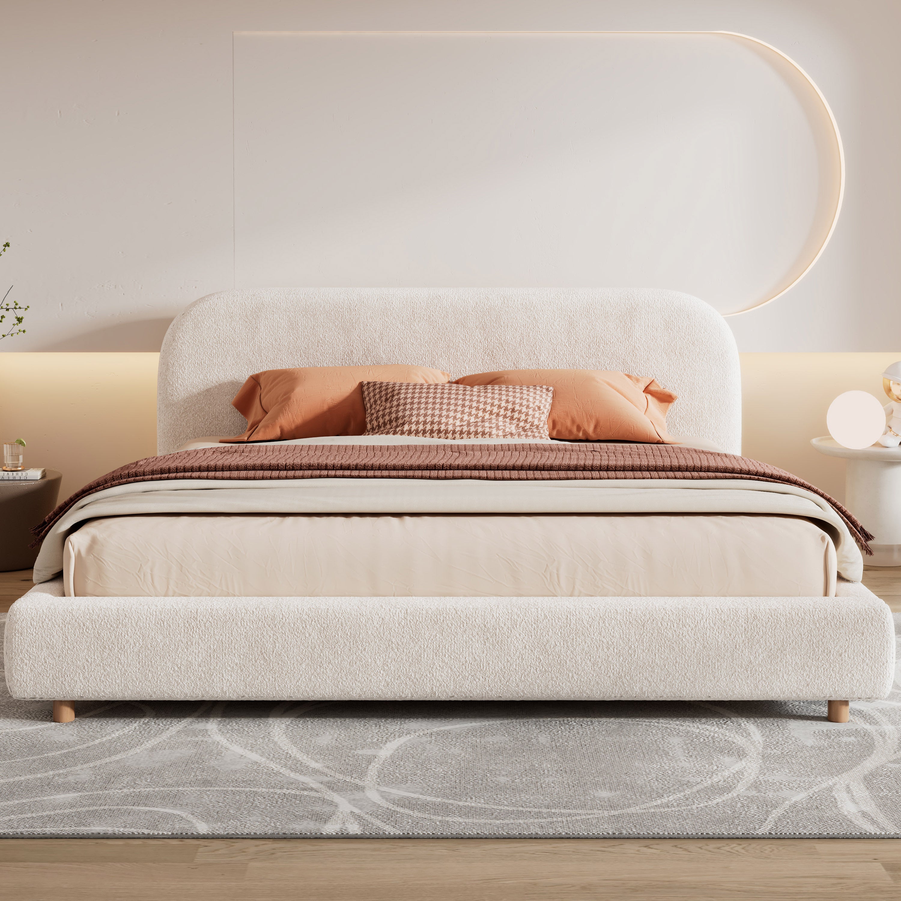 White boucle king bed, front view with orange and taupe bedding