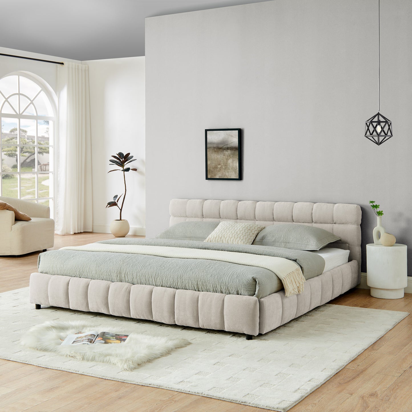 Front angle of beige chenille king bed with plant and side table