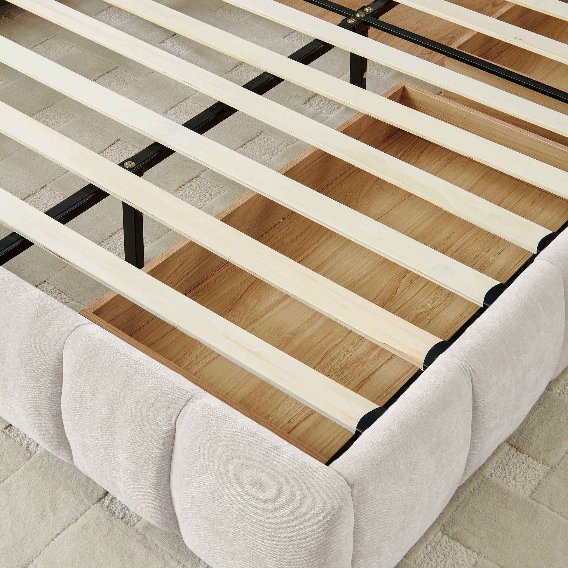 Angled view of open wood drawer with exposed wood slat support