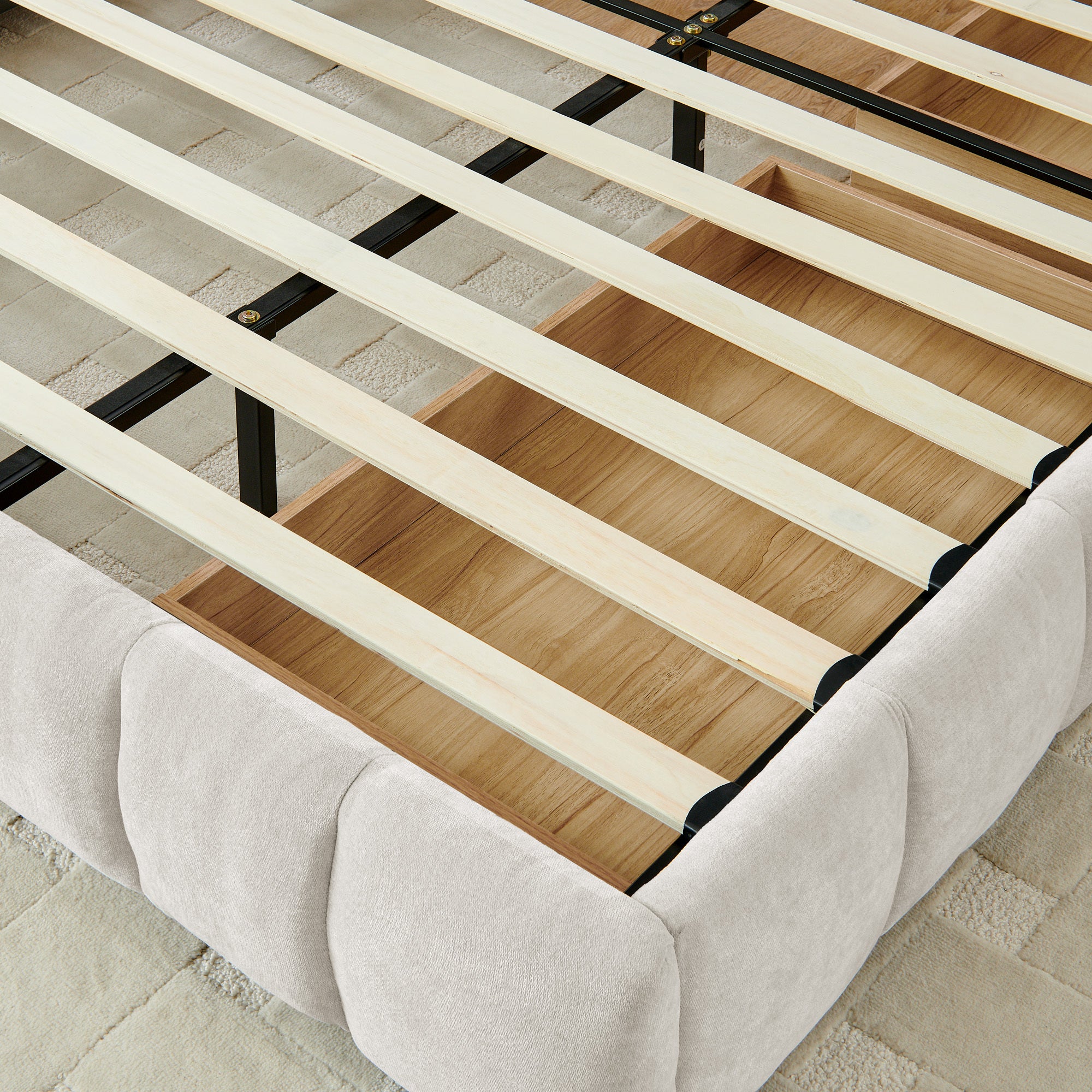 Angled view of open wood drawer with exposed wood slat support