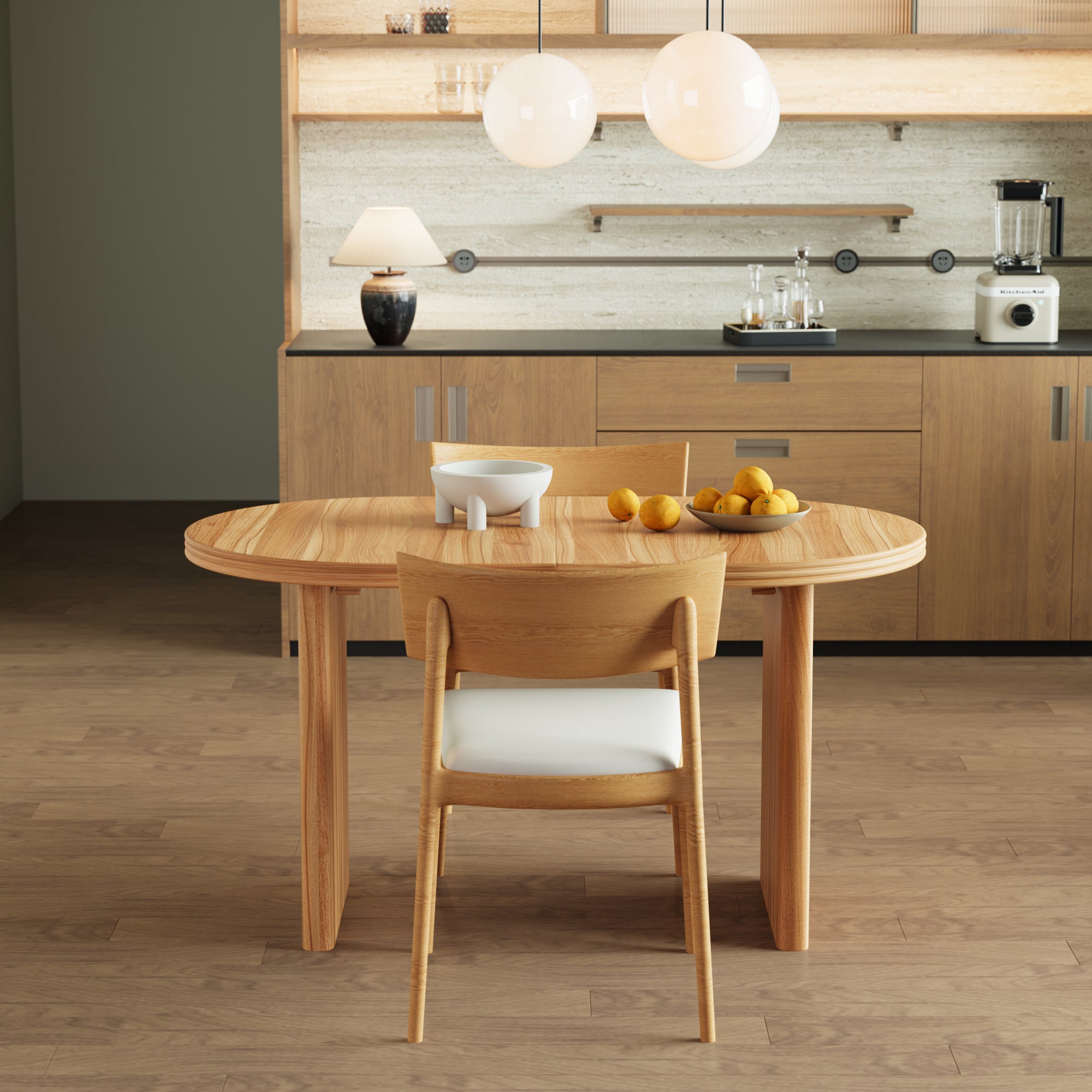 Front view of the natural wood oval table extended with a single wood chair in a kitchen