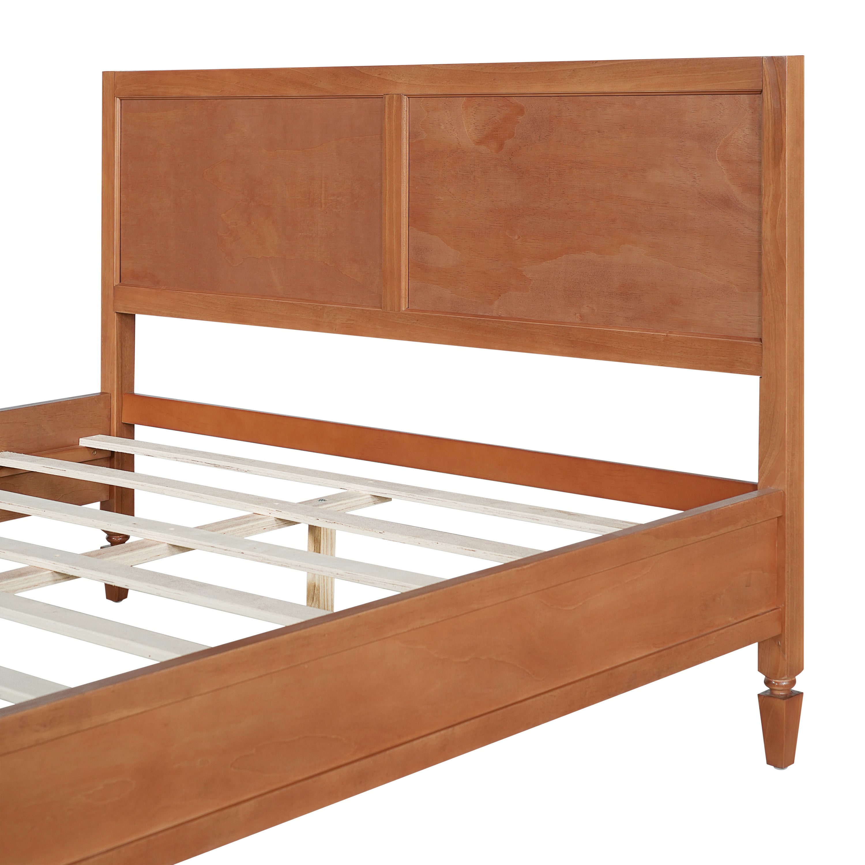 Close-up of the two framed panels on the brown wood platform bed headboard in a warm finish