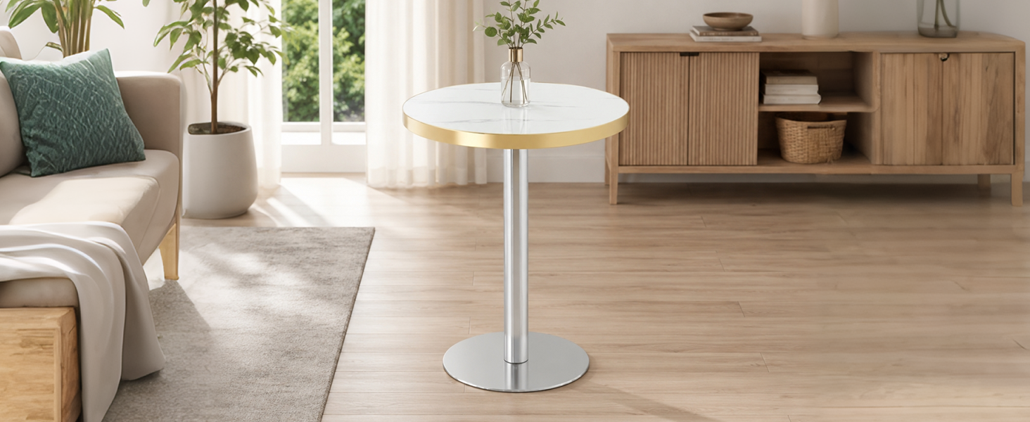 White faux marble gold-trim bistro table with chrome base in a bright living room beside a sideboard