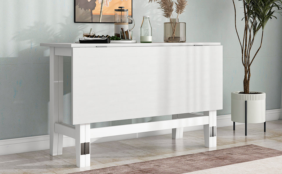 White drop-leaf table folded flat against a wall as a console with decor on top