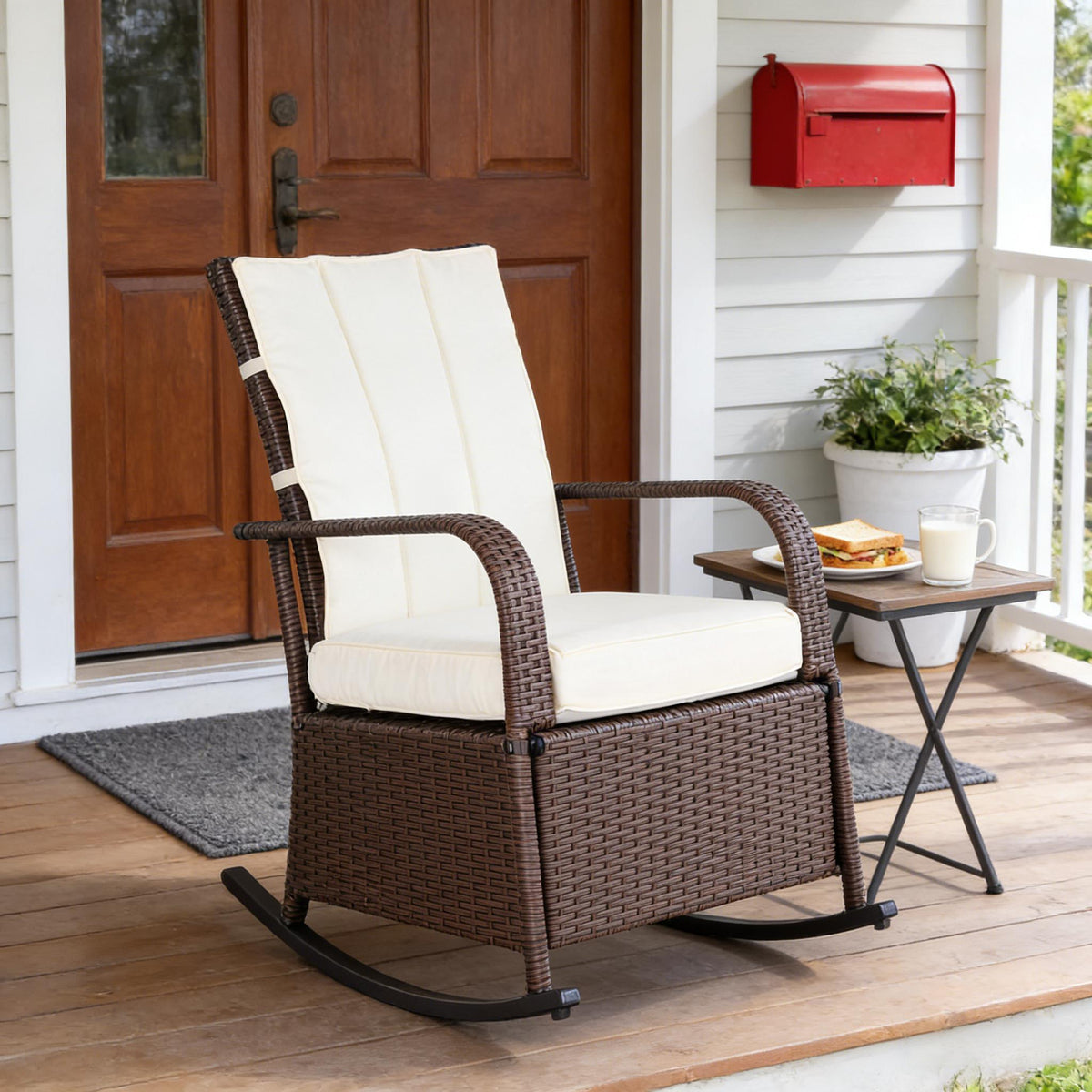 Brown Wicker Outdoor Rocking Chair with White Cushions