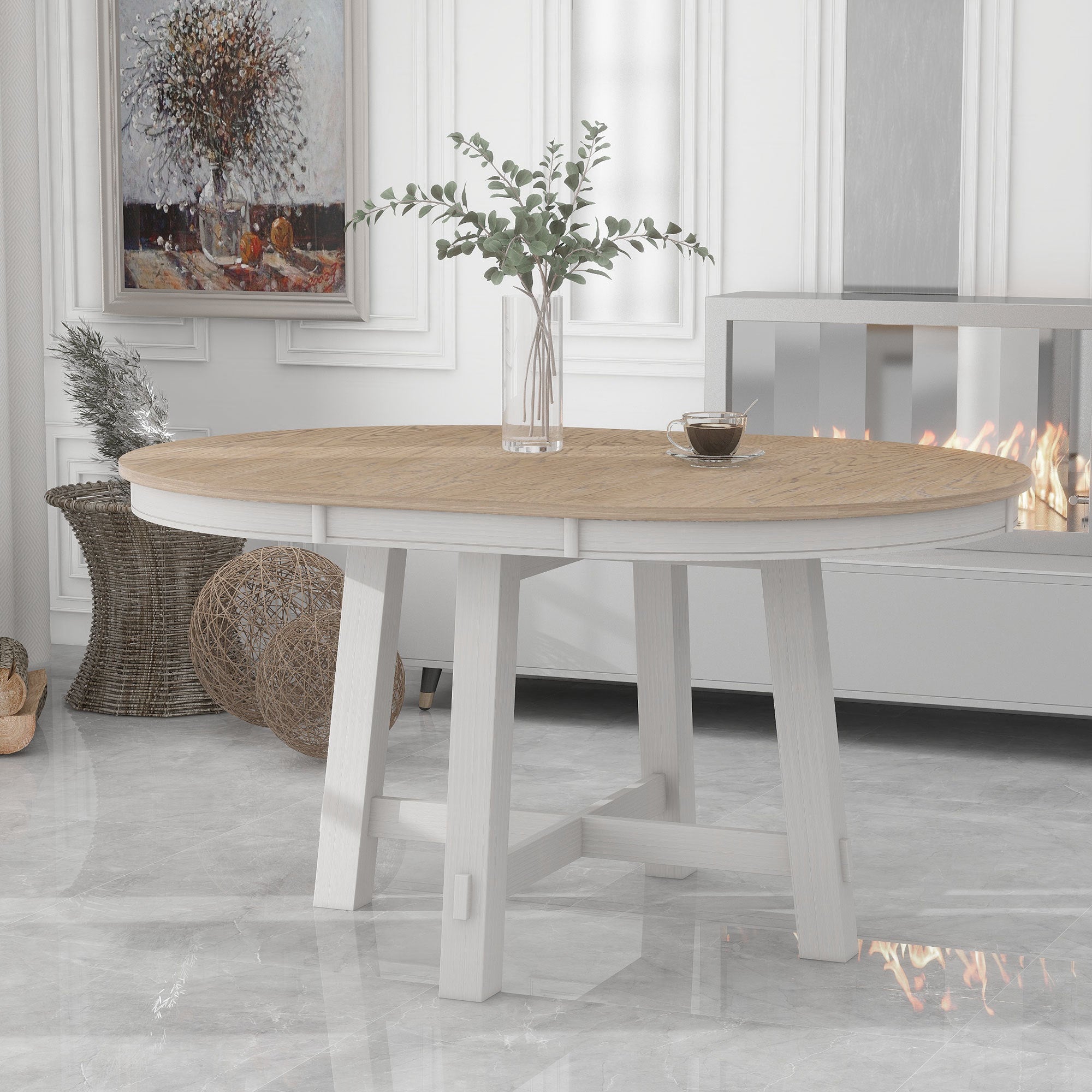 Three-quarter view of round extendable table with oak top and antique white base by a fireplace