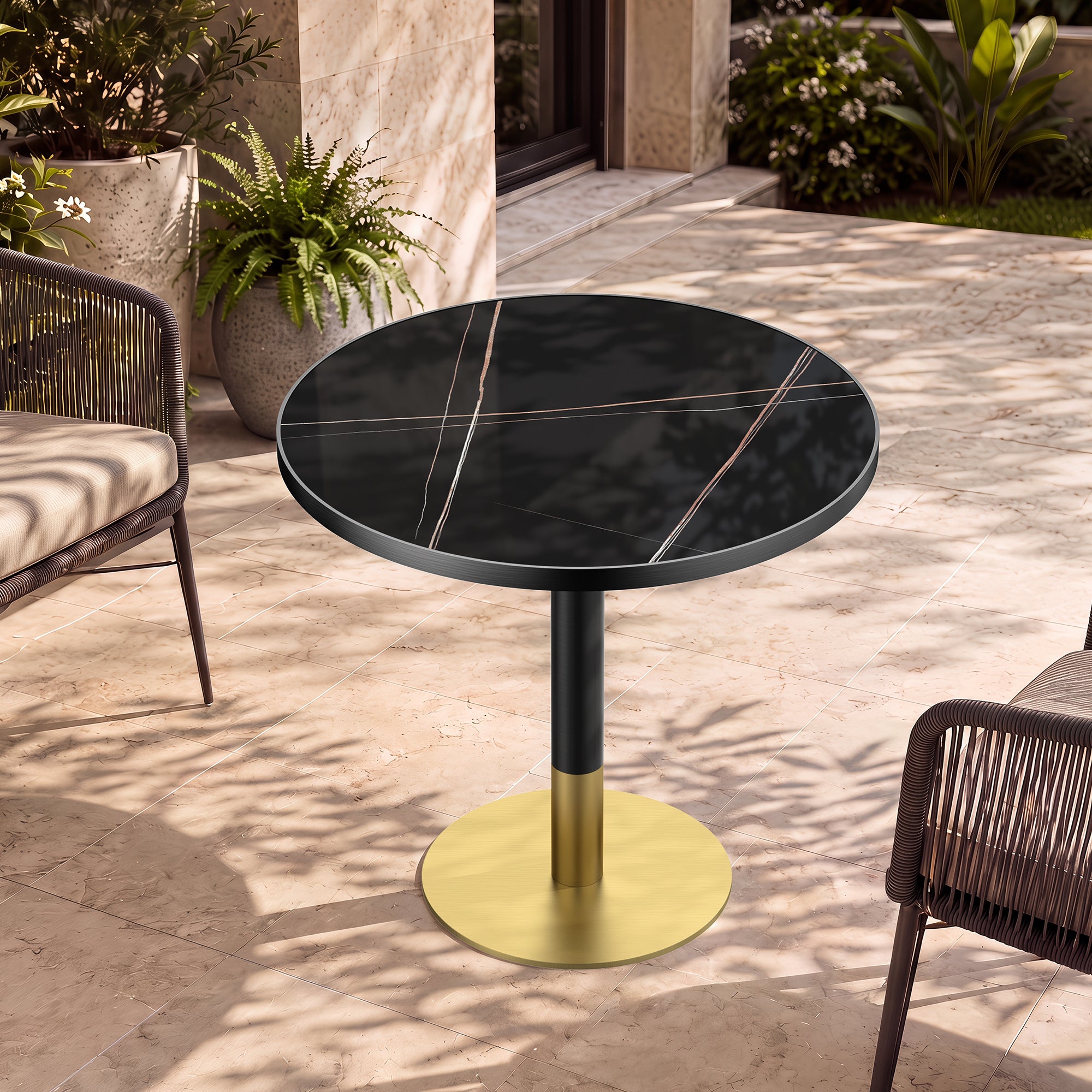 Outdoor patio setting with the gold and black round sintered stone dining table between woven chairs