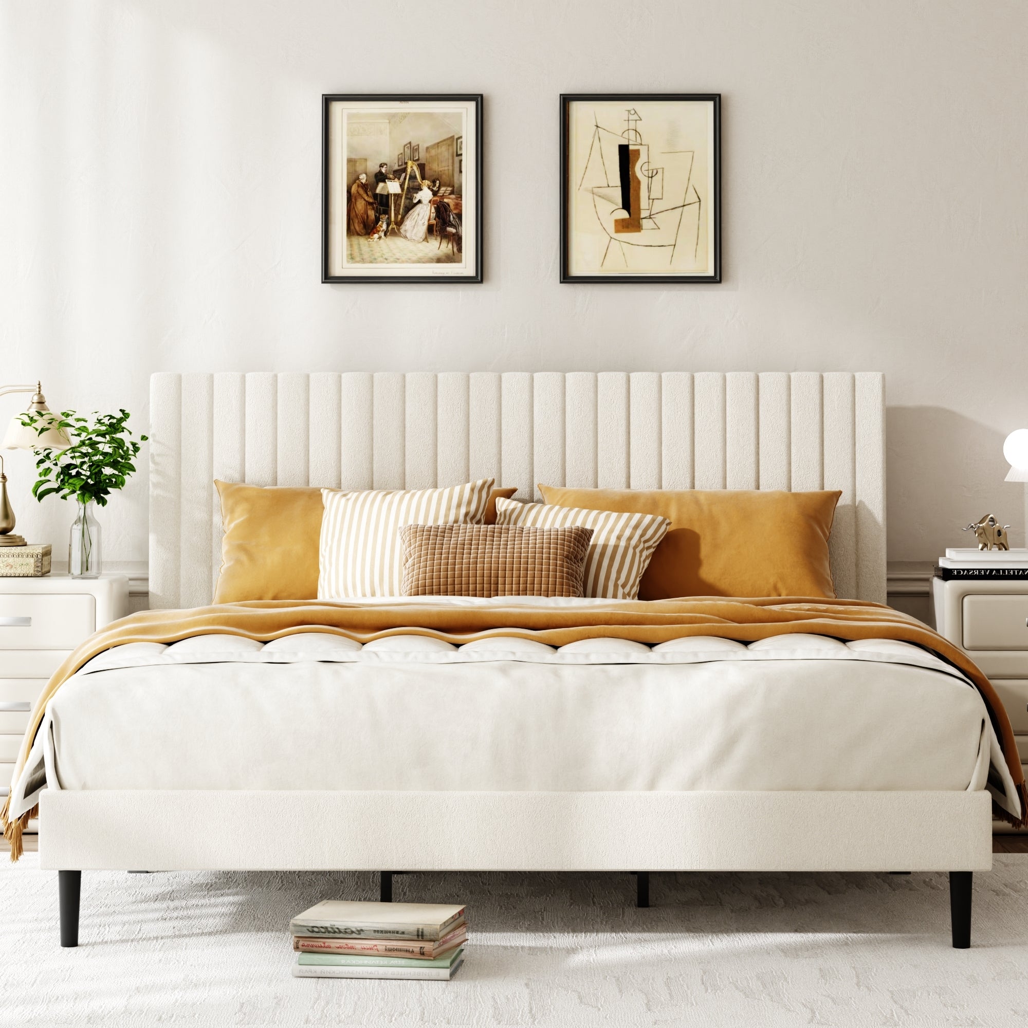 Close-up of channel-tufted beige velvet headboard behind styled pillows