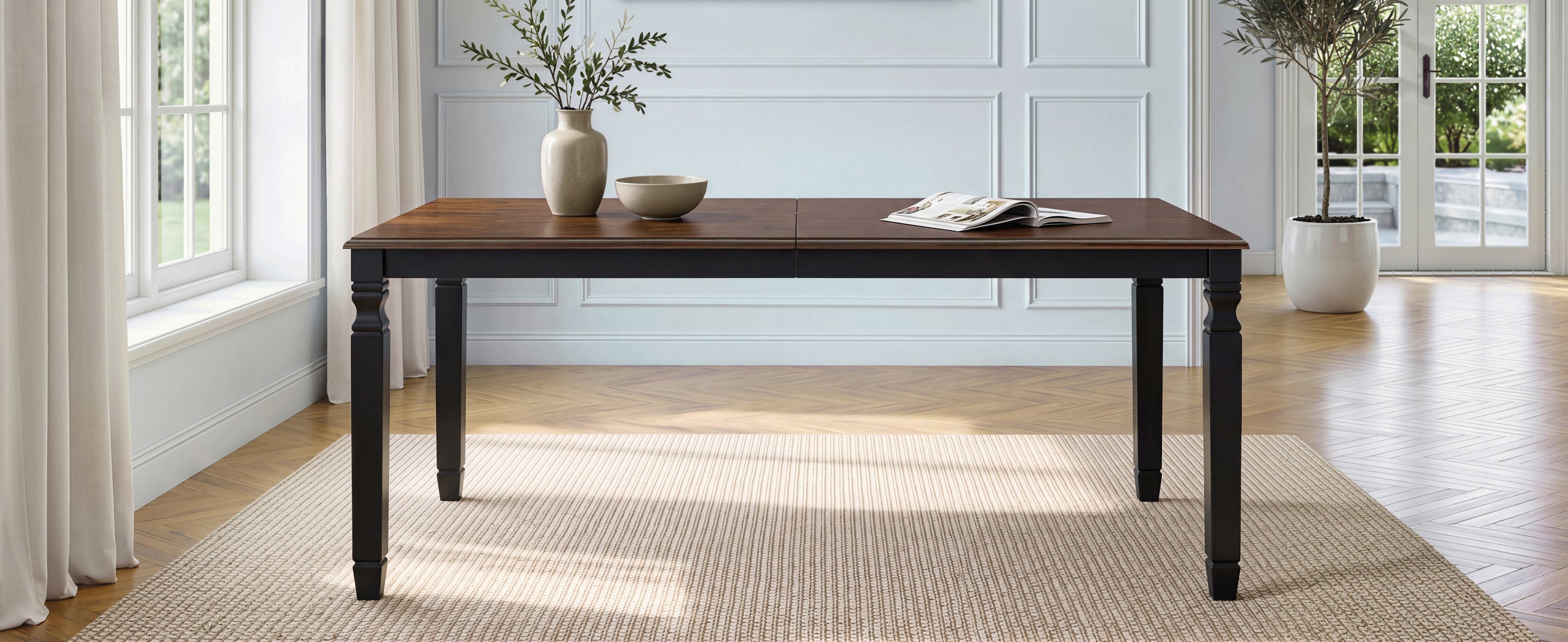 Espresso oak veneer farmhouse dining table, wide front view on a woven rug in a paneled dining room