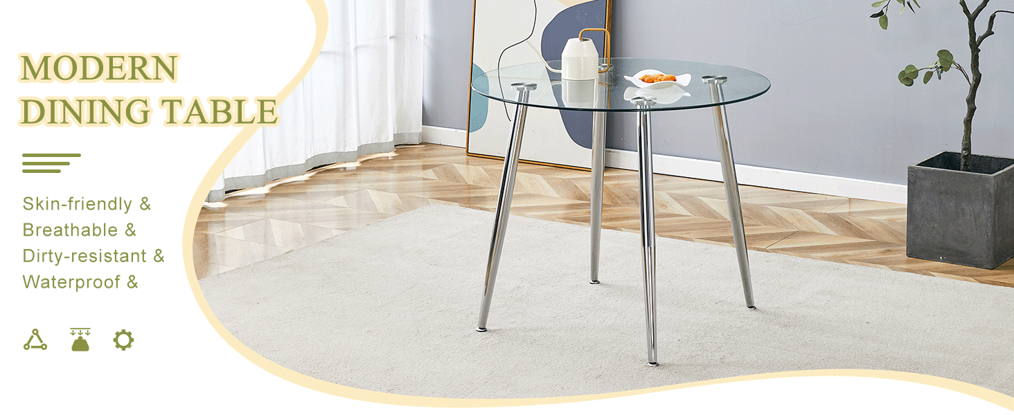 Round glass dining table with silver legs styled in a room beside a potted plant