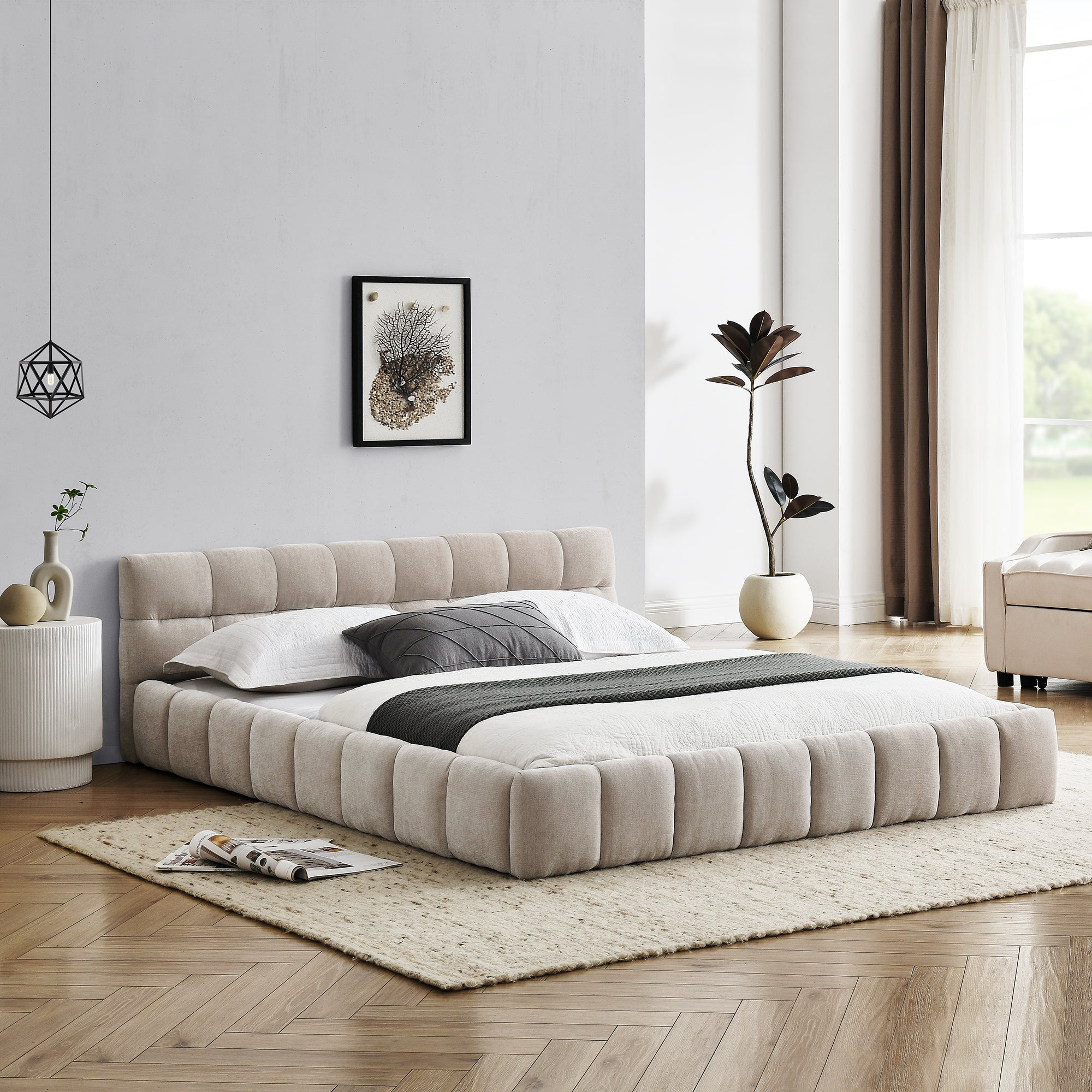 Beige chenille channel-tufted platform bed made up in a bedroom, side angle with wood floor and rug #Color_Beige